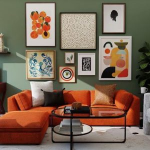 Bright upholstery on a dark sage green wall