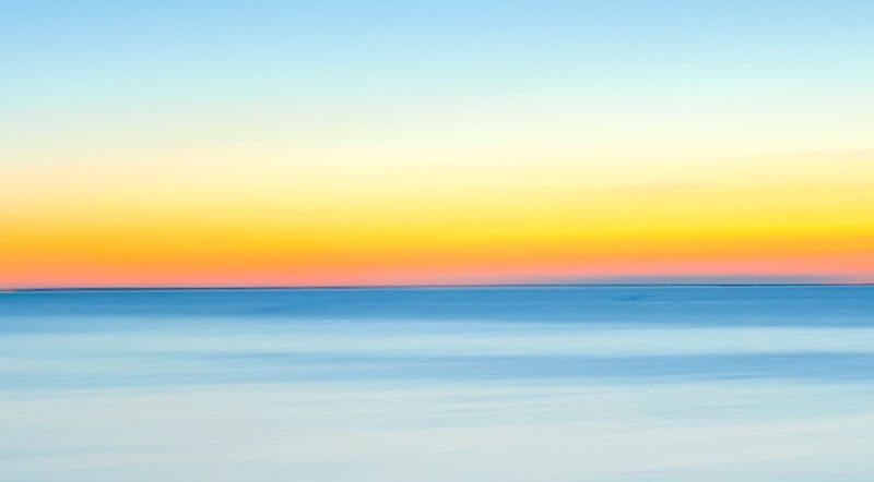 Horizon at dawn on a calm lake