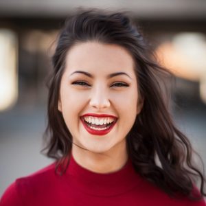 Woman laughing in front of camera