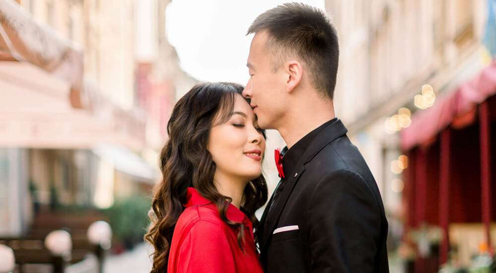 Man Kissing Woman