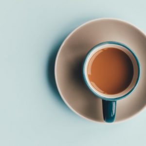 Blue coffee cup on a light blue background