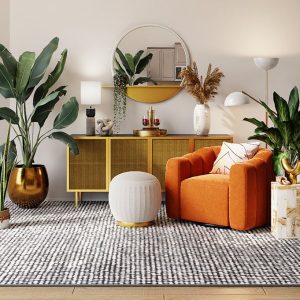 Stylishly decorated interiors with orange sofa