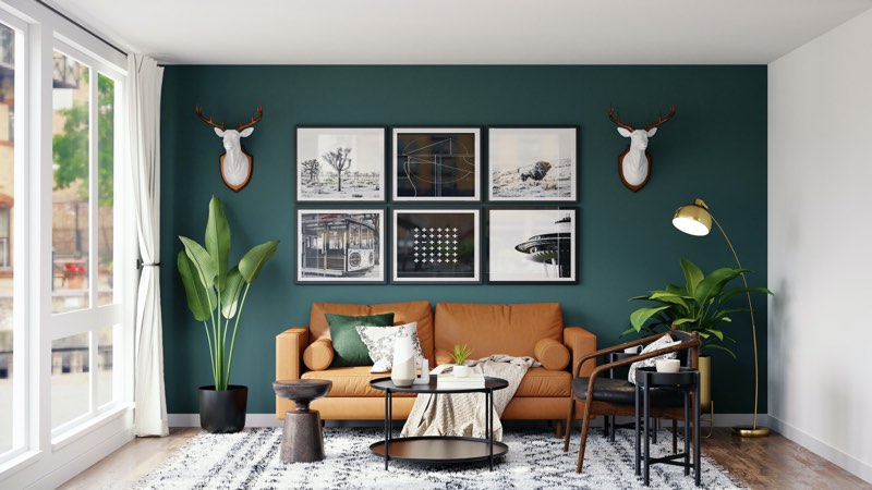 Living room with a dark blue-green colored wall and brown sofa