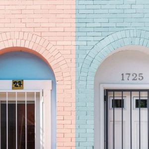Two differently colored pastel walls with doors