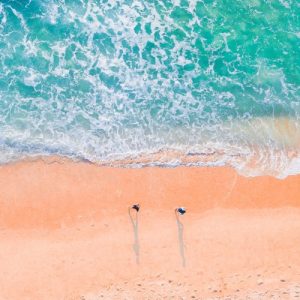 Photo of sand and sea taken from a drone