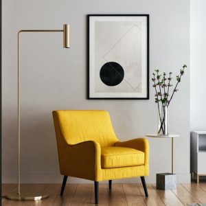 Yellow winged chair in neutral surroundings