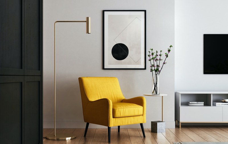 Yellow winged chair in neutral surroundings
