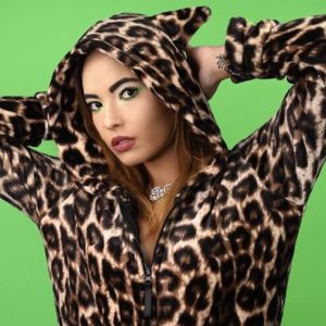 Woman wearing a leopard print hoodie on a green background