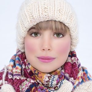Pretty woman in winter clothes and hat