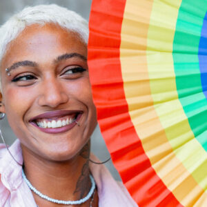 Woman with Rainbow Colorful Umbrella - Image