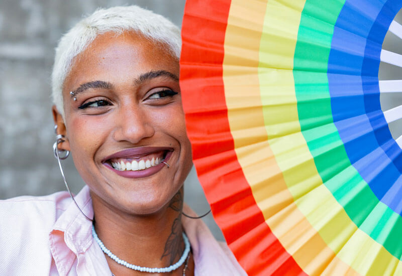 Woman with Rainbow Colorful Umbrella Image